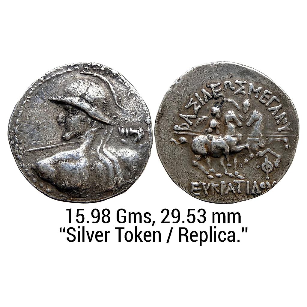 A token/replica of a tetradrachm coin of Eucratides I who ruled the Indo-Bactrian kingdom during the period of 171-145 BCE Silver Token